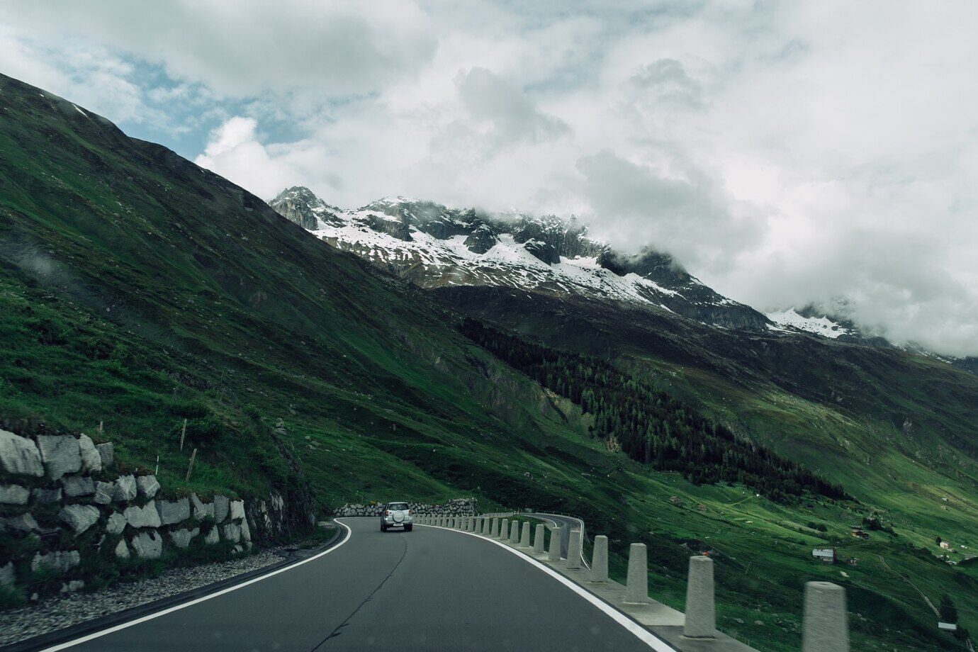 road-swiss-alps-mountains-summer-cloudy-weather_8353-6496